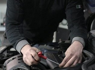 Look under the hood for damage and other issues that can lead to a lower vehicle value.