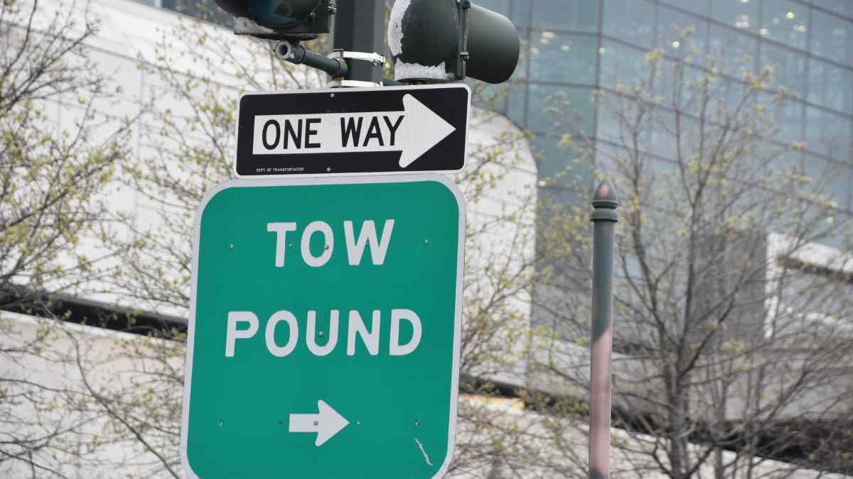 Tow sign for car impound lot